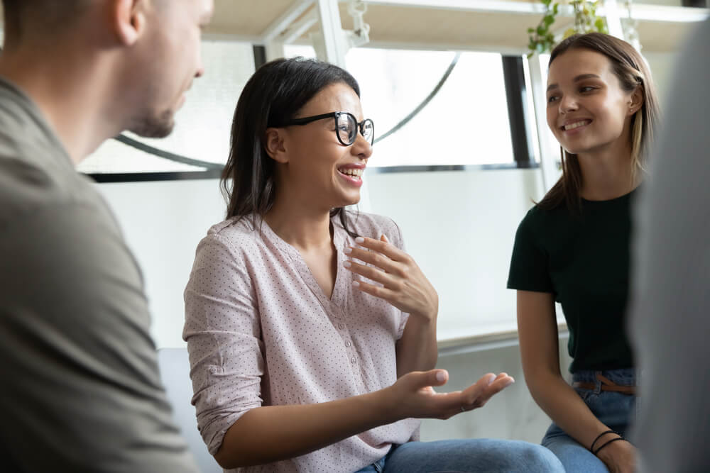 Woman talking to her colleagues