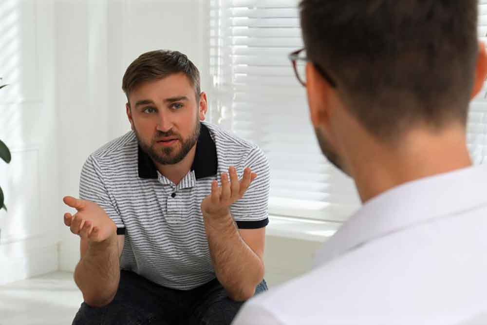 a male talking to his therapist