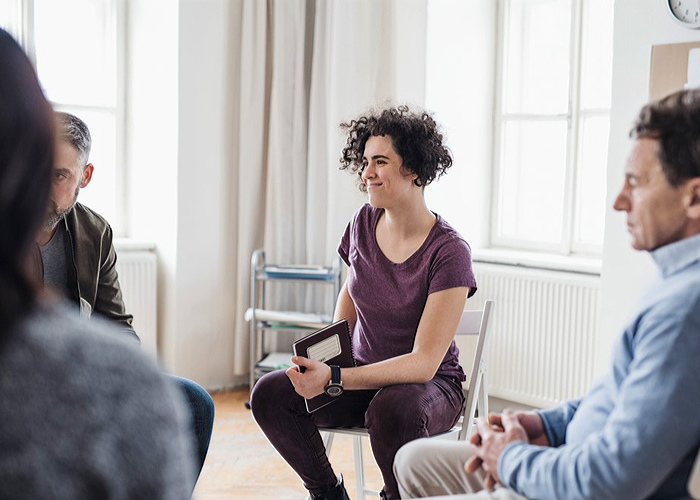 Woman in a group meeting