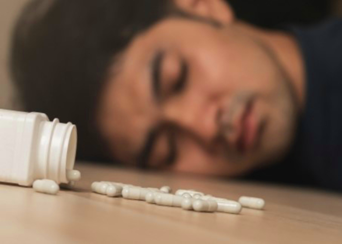 A man having an overdose on sleeping pills