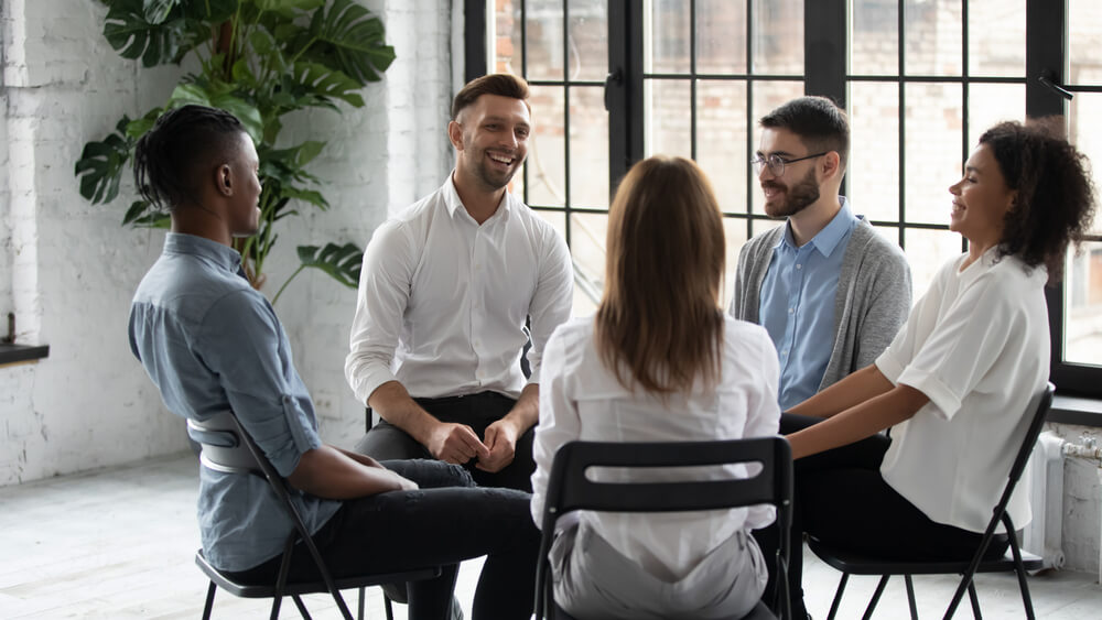 Group of individual talking to each other in a group session