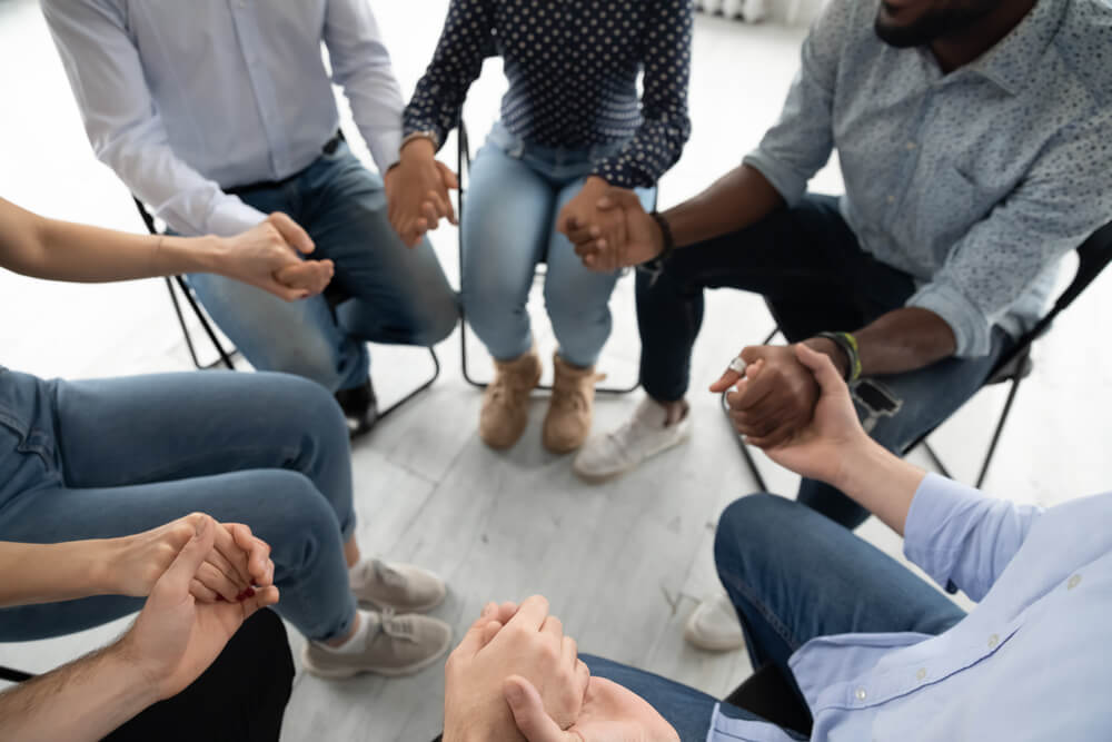 Group of individual holding hands