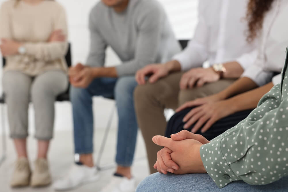 everyone is listening while in a group session in rehab center