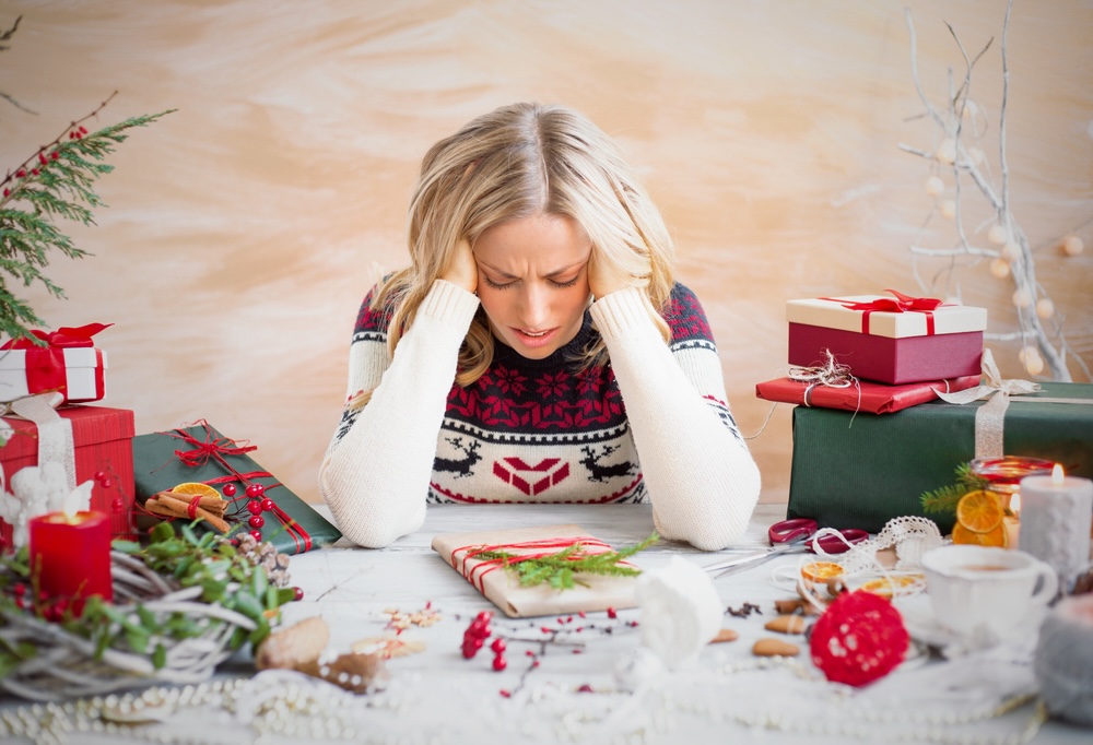 Woman depressed with Christmas gift clutter