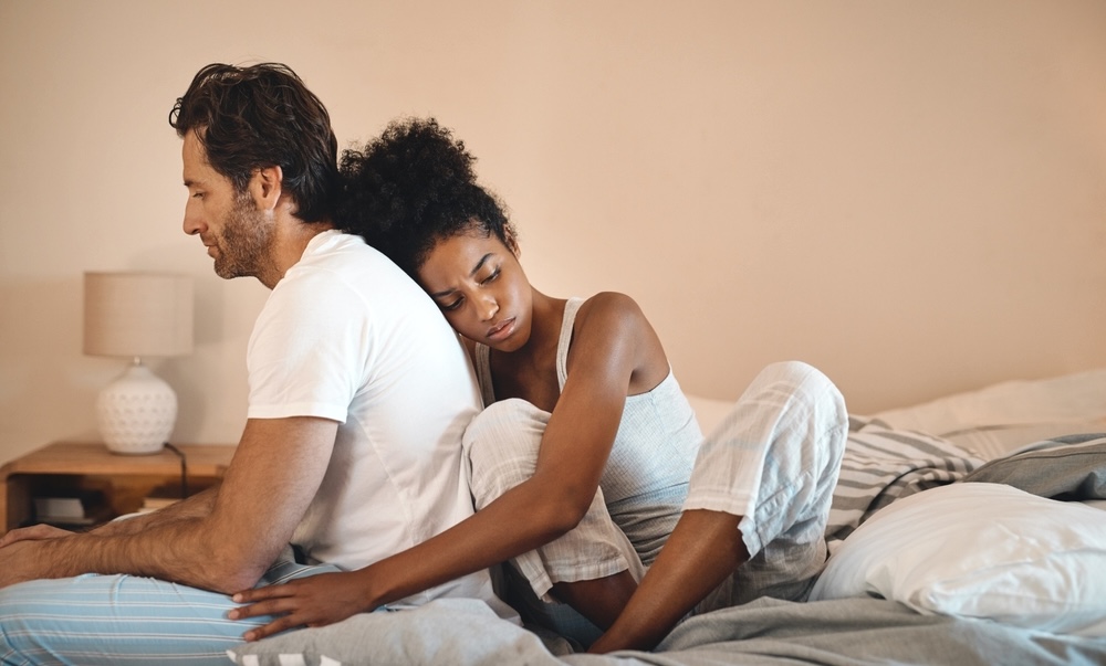 Sad, frustrated and unhappy man and woman hugging