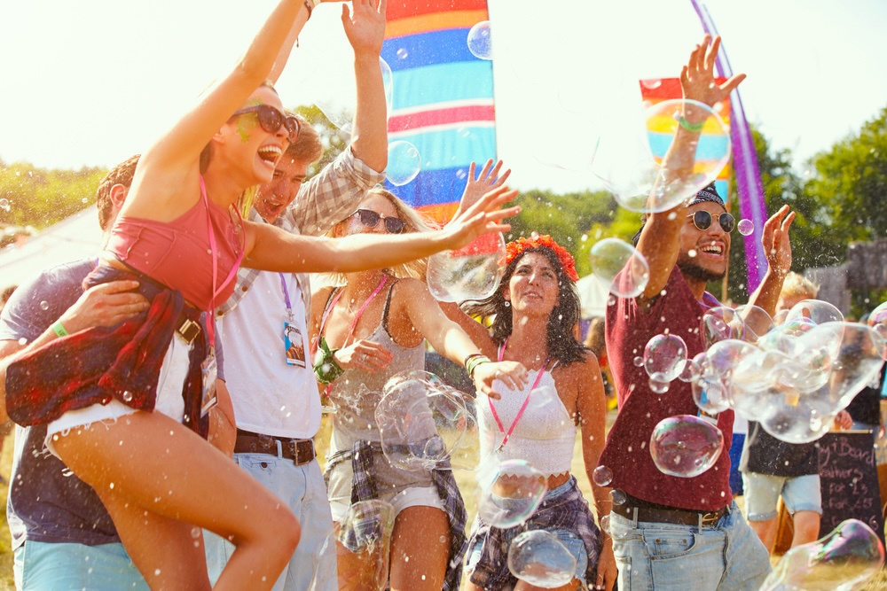 Friends enjoying a performance at a music festival