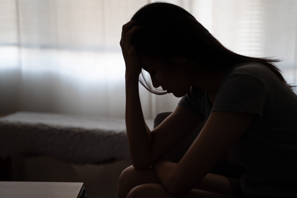 Silhouette of a woman struggling in addiction recovery