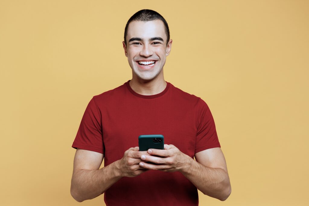 Man in a red shirt texting proud of you sobriety quotes