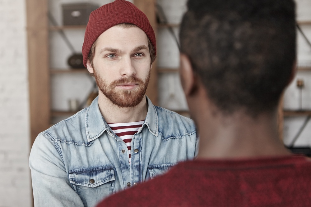 Two male friends talking about addiction treatment in Beverly Hills CA