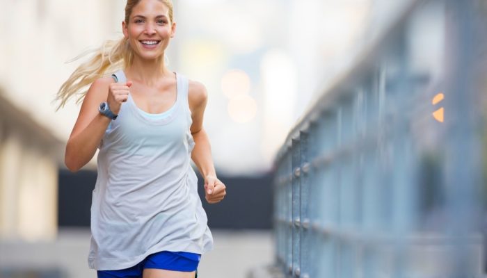 A woman running through city streets