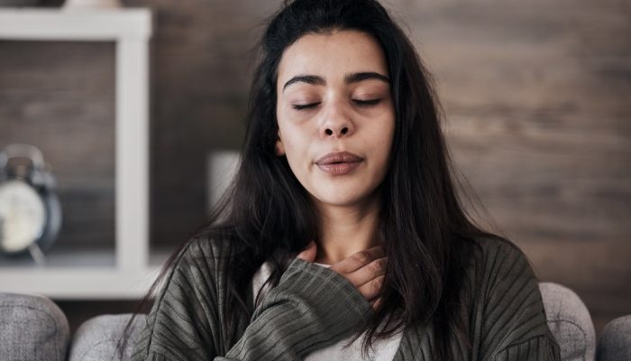 A woman calming down herself with anxiety problems